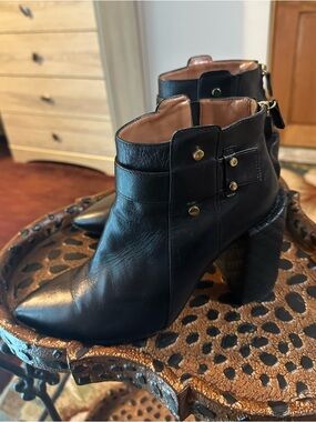 BCBGMaxAzria Black Leather Pointed Ankle Booties with Gold Hardware